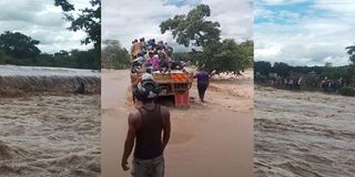 An attempt by some locals to cross the flooded river in a lorry ended in disaster when the vehicle was swept away.